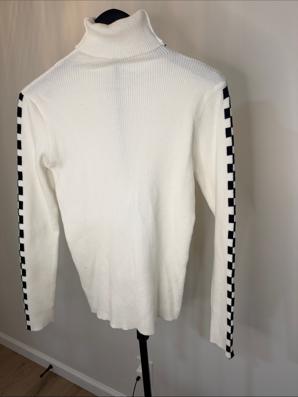 Women’s White Turtleneck Sweater with Black Checker Sleeve Detail